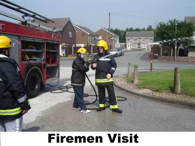 Picture of student holding a firemans hose